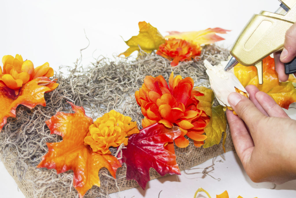 fall table display gluing corn