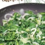 pan of sauteed spinach with caramelized onions cooking