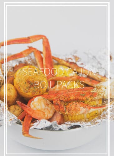 a white bowl of seafood, corn, potatoes, sausage and lemon in foil for seafood cajun boil packs