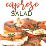 white plate of sliced tomatoes and mozzarella cheese with chopped basil and balsamic glaze on top