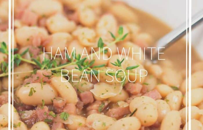 ham and bean soup with thyme in a bowl really up close with title