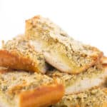 white plate of cooked sliced paremsan garlic bread
