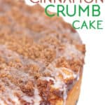 close up shot of a apple cinnamon crumb cake with icing dripping off the side