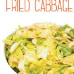 a white bowl of cajun fried cabbage with title