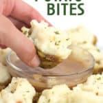 white plate with stuffing potato bbites with one dipping in gravy