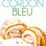 white plate of cut down the middle cordon bleu with ham and cheese inside chicken breast