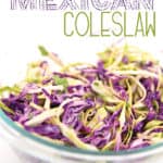 a glass bowl of green and red cabbage shredded for Mexican coleslaw with title