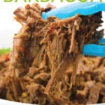 white bowl of shredded slow cooker beef barbacoa with cilantro