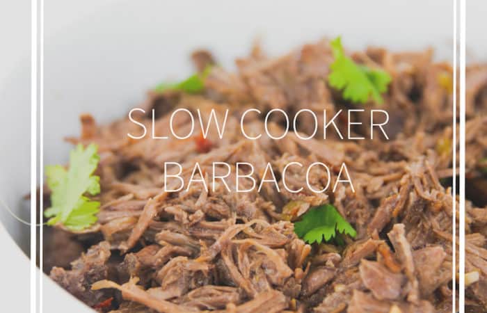 white bowl of shredded slow cooker beef barbacoa with cilantro with title
