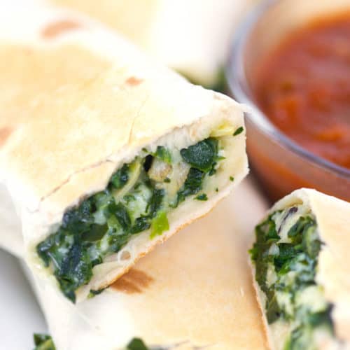 spinach and feta rolled in a tortilla and cooked with a cup of salsa