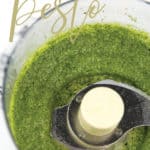 food processor bowl with green basil pine nut pesto