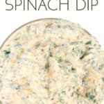 overhead shot of a glass bowl with spicy ranch spinach dip in it