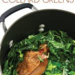 a pot of cooked collard greens with a cooked ham hock