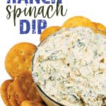 a bowl of spicy ranch spinach dip on a plate of ritz crackers around it