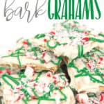 a white plate with white chocolate graham crackers with green drizzle and peppermints