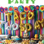 streamer back drop with mexican flowers border wih taco twosday balloons with mexican food table with title