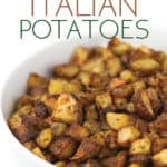 white bowl of roasted zesty italian potatoes with parsley sprinkled on top