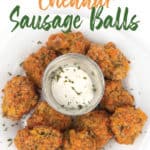 overhead shot of a white plate with jalapeno cheddar sausage balls with sprinkled parsley and a cup of ranch