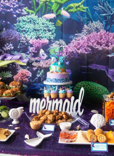 table spread of a mermaid/under the sea theme for a mermaid themed birthday