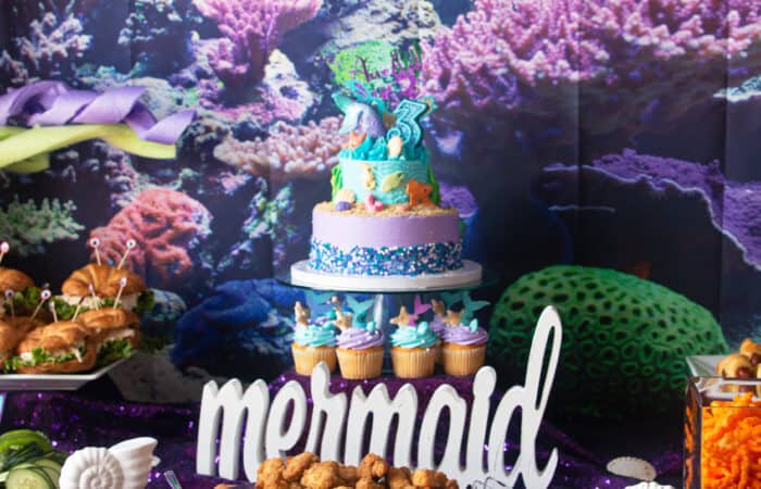 table spread of a mermaid/under the sea theme for a mermaid themed birthday