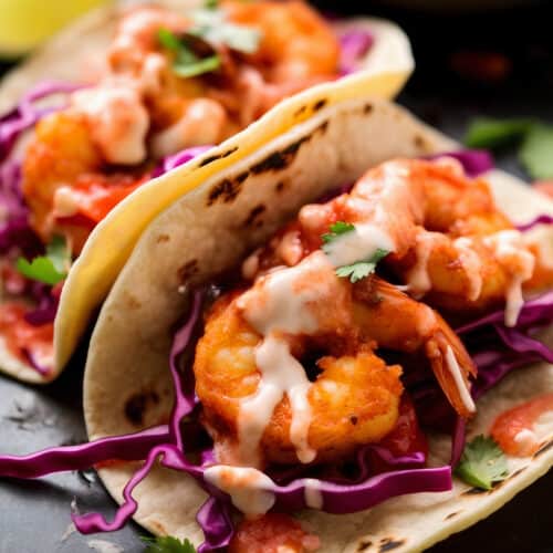 Dynamite Shrimp Tacos with a flour tortilla, spicy sauce and breaded shrimp