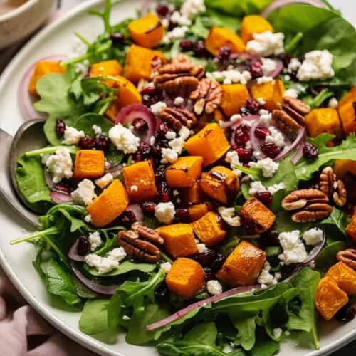 a big bowl of Pumpkin & Feta Salad with Pecans & Cranberries