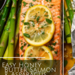 foil pack with a salmon filet and asparagus with lemon slices and a butter sauce