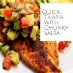 a tilapia filet seasoned and cooked with a chunky avocado salsa on top