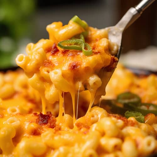 a pan of Spicy Pimento Mac & Cheese with Panko with a spoon